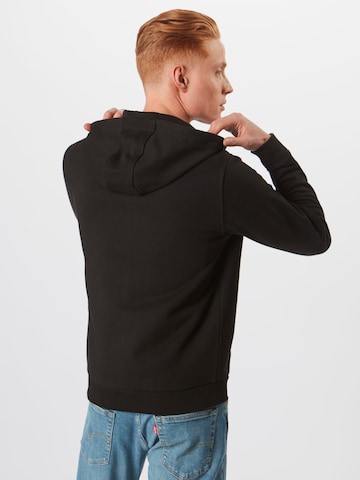 Veste de survêtement LACOSTE en noir : derrière