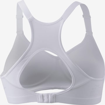 Bustino Reggiseno sportivo 'Rival' di NIKE in bianco