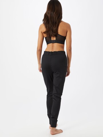 Effilé Pantalon de sport CURARE Yogawear en noir