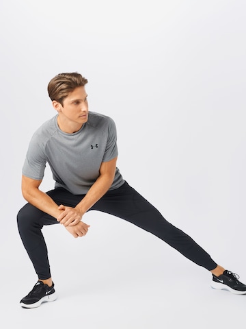 UNDER ARMOUR Regular Urheiluhousut 'Unstoppable' värissä musta