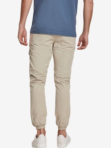 Tapered Pantaloni cargo di Urban Classics in beige