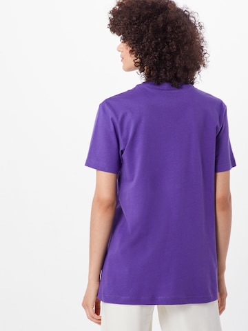 Merchcode Shirt 'Never On Time' in Purple: back