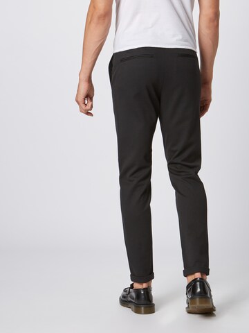 Lindbergh Slim fit Trousers 'Superflex' in Black: back