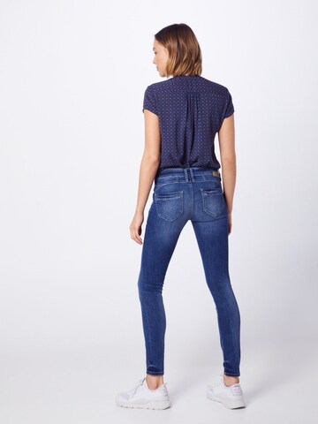 Skinny Jean 'Nena' Gang en bleu : derrière