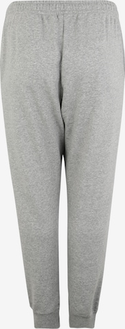 Effilé Pantalon Nike Sportswear en gris : derrière