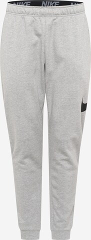 NIKE Tapered Workout Pants in Grey: front