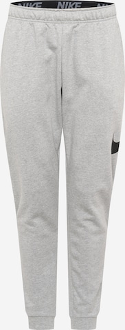 NIKETapered Sportske hlače - siva boja: prednji dio