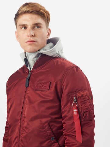 ALPHA INDUSTRIES Between-Season Jacket 'MA-1 D-Tec' in Red