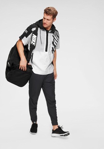 Slimfit Pantaloni sport de la NIKE pe negru