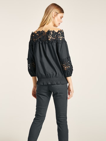 heine - Blusa en negro: atrás