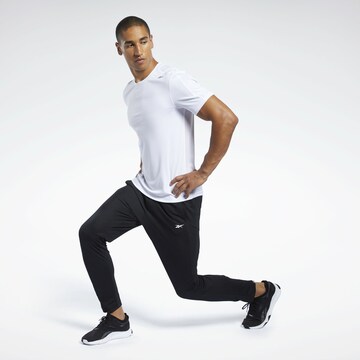 Effilé Pantalon de sport Reebok en noir