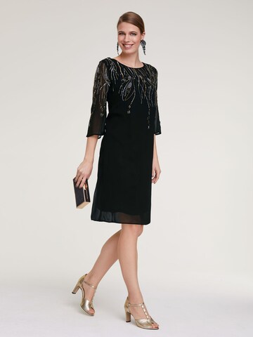 Rochie de cocktail de la heine pe negru