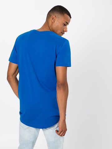 T-Shirt Urban Classics en bleu : derrière