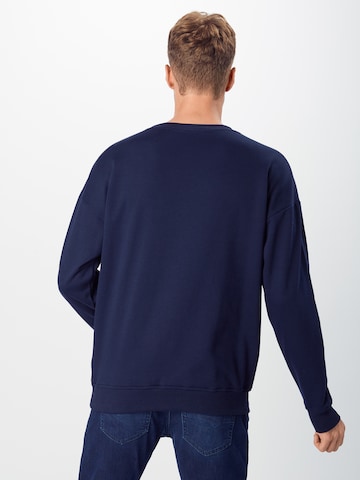 Sweat-shirt Urban Classics en bleu : derrière