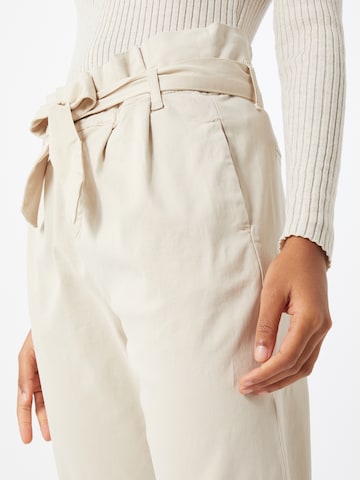 Cartoon Tapered Pleat-Front Pants in Beige