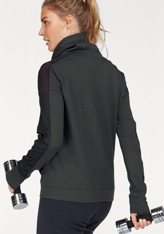 UNDER ARMOUR Sportief sweatshirt 'Featherweight Funnel' in Zwart