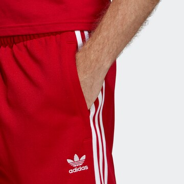 Effilé Pantalon 'Sst Tp' ADIDAS ORIGINALS en rouge