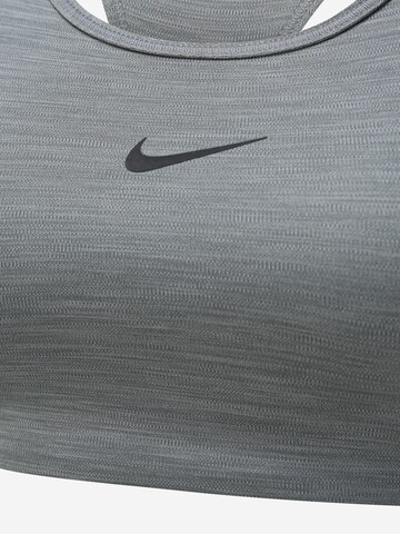 NIKE Μπουστάκι Αθλητικό σουτιέν σε γκρι