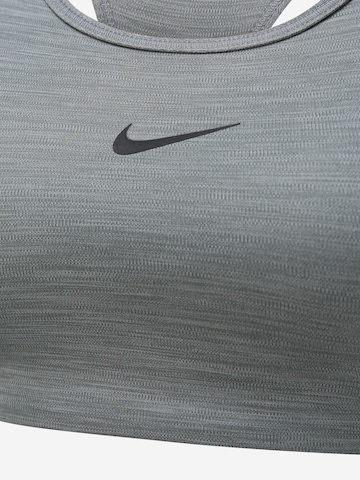 NIKE Korzetová Sportovní podprsenka – šedá