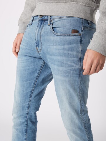 Slimfit Jeans 'Revend' de la G-Star RAW pe albastru