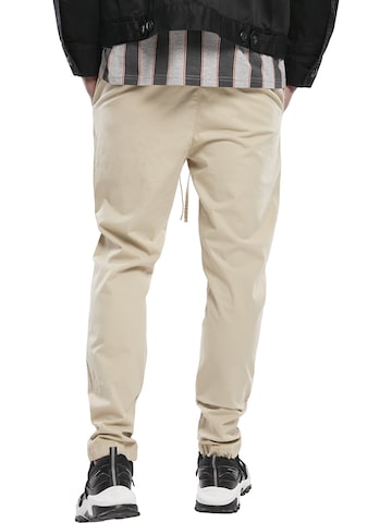 Urban Classics Zwężany krój Spodnie w kolorze beżowy