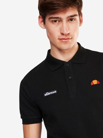 ELLESSE Poloshirt 'MONTURA' in Schwarz