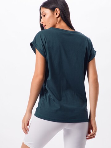 T-shirt Urban Classics en vert : derrière