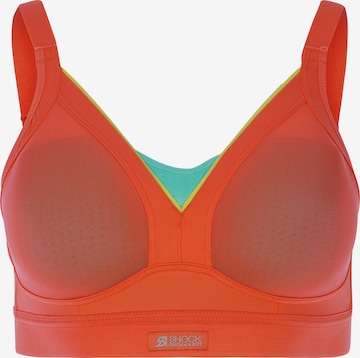 SHOCK ABSORBER Sports Bra in Orange: front