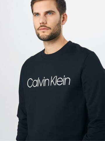 Calvin Klein كنزة رياضية بلون أسود