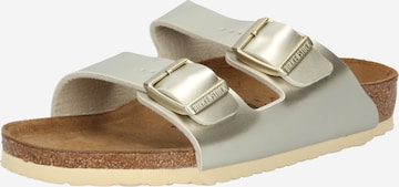 BIRKENSTOCK Sandals & Slippers 'Arizona' in Gold: front