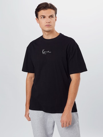 Karl Kani Regularny krój Koszulka 'Signature' w kolorze czarny: przód