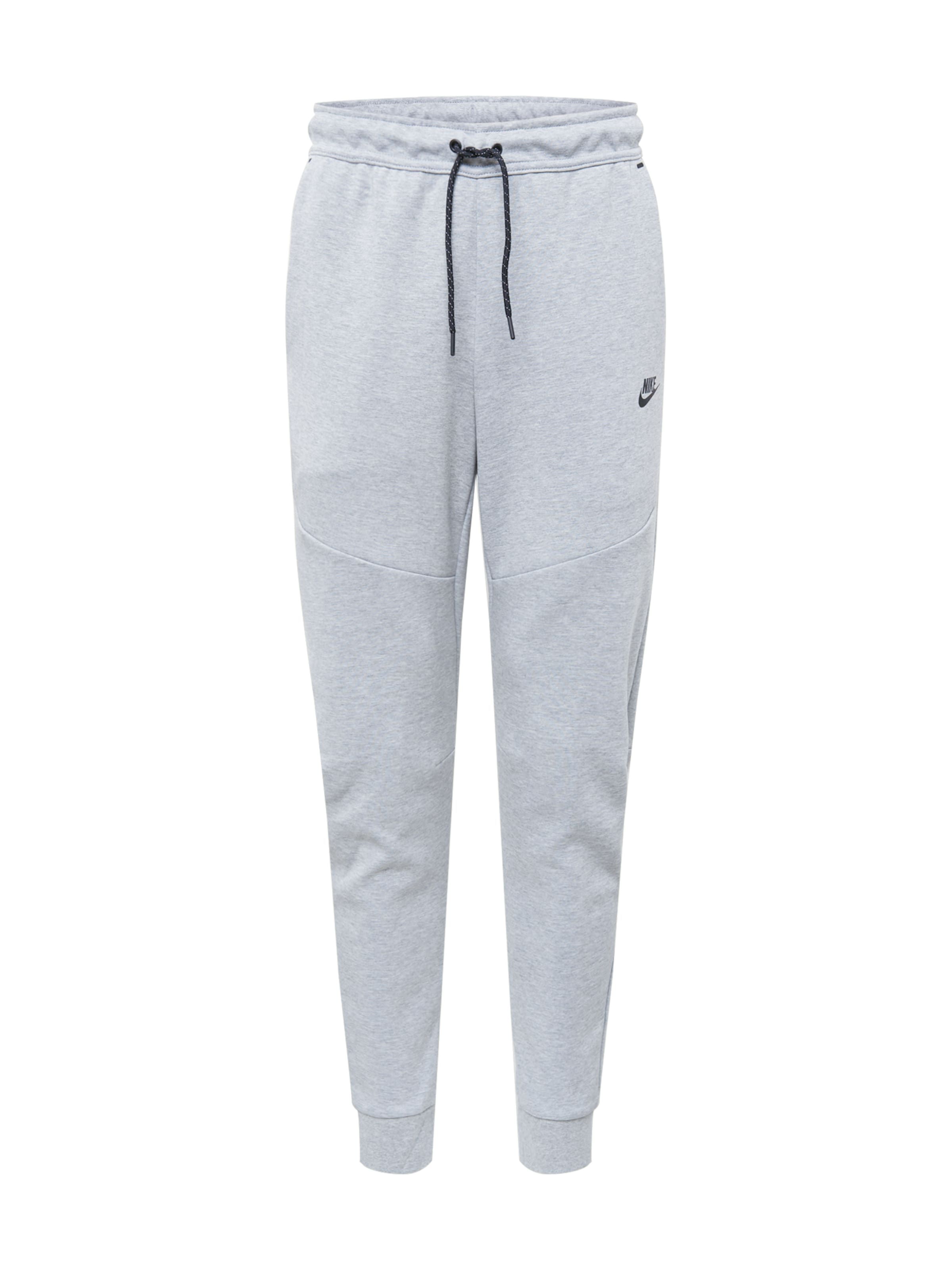 Nike Sportswear - Tapered Calças 'Tech Fleece' em cinzento: frente