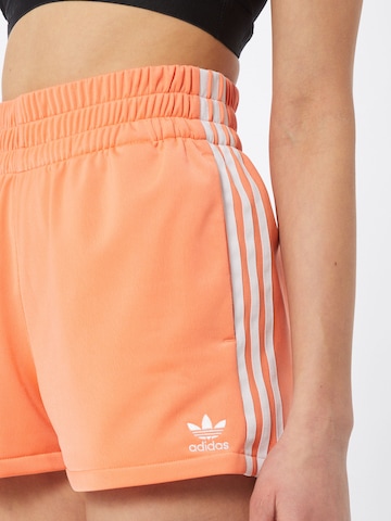 ADIDAS ORIGINALS Regular Pants '3-Stripes' in Orange