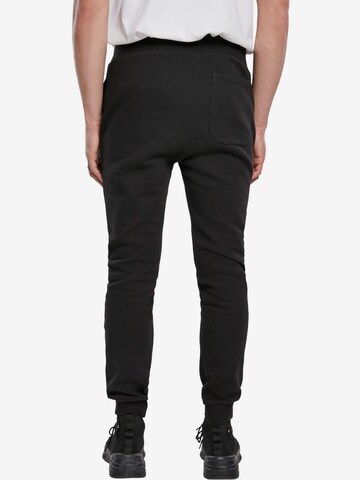 Tapered Pantaloni di Urban Classics in nero