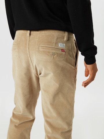 smėlio LEVI'S ® Siaurėjantis „Chino“ stiliaus kelnės