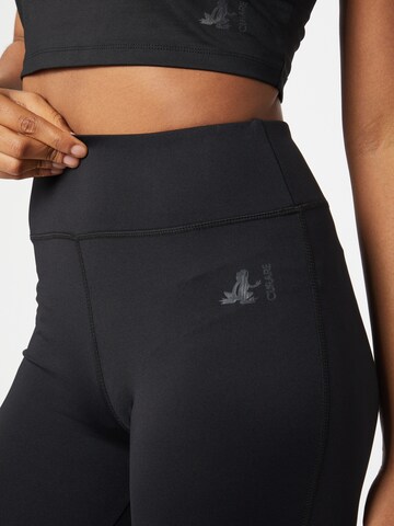 Skinny Pantaloni sportivi di CURARE Yogawear in nero