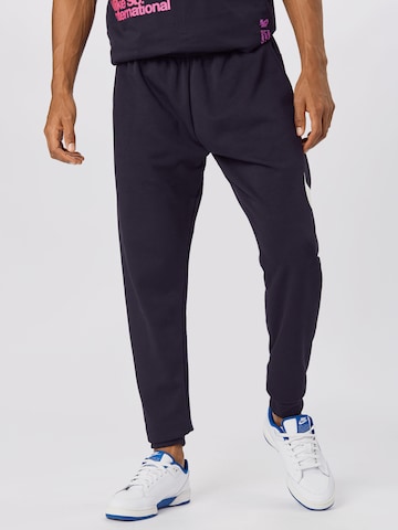 Effilé Pantalon de sport NIKE en noir : devant