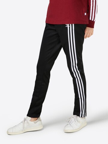 Skinny Pantalon ADIDAS ORIGINALS en noir : devant