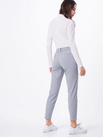Slimfit Pantaloni cutați de la TOM TAILOR DENIM pe gri: spate