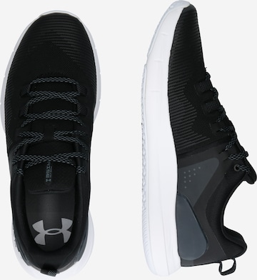 Chaussure de course UNDER ARMOUR en noir : sur le côté