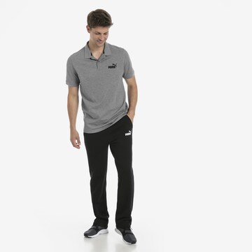 PUMA Poloshirt in Grau