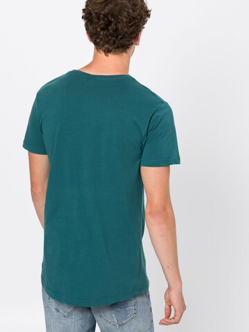 T-Shirt Urban Classics en vert : derrière