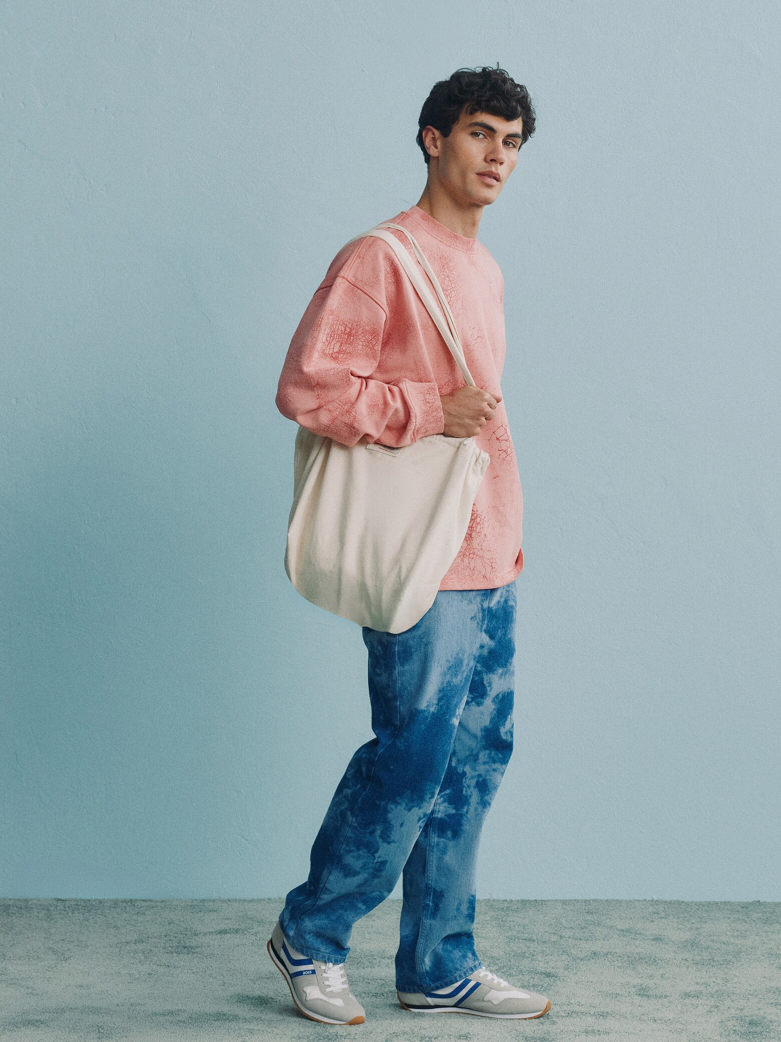 Diego Alvarez - Pink Sweater With Denim Trousers Look