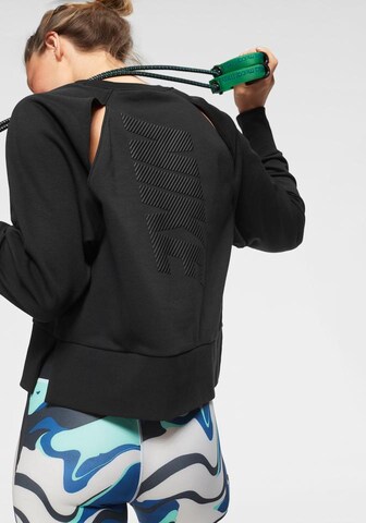 NIKE Sportief sweatshirt 'Versa' in Zwart