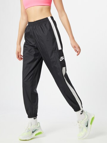 Nike Sportswear Tapered Pants in Black: front