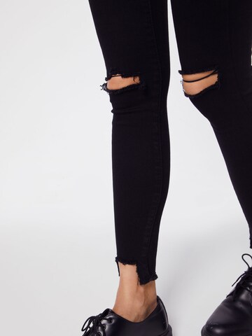 NA-KD Skinny Džíny 'High Waist Ripped Jeans' – černá