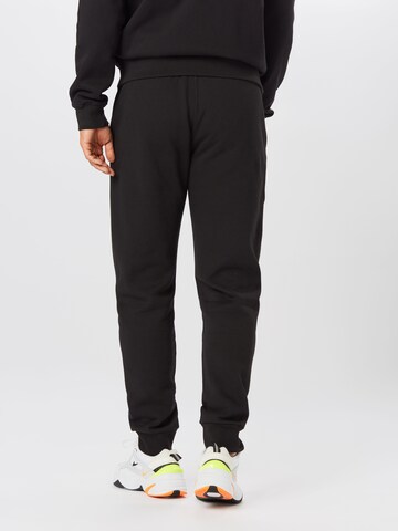 Tapered Pantaloni de la Champion Authentic Athletic Apparel pe negru