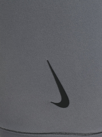 pelēks NIKE Šaurs Sporta bikses 'Nike Yoga Dri-FIT'