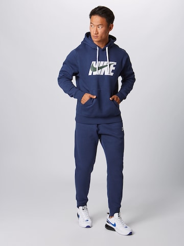 Nike Sportswear Regularen Trenirka za tek | modra barva