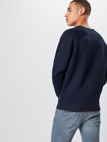 Sweat-shirt Urban Classics en bleu : derrière